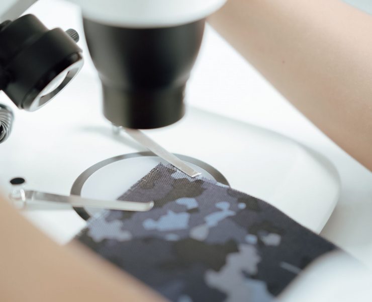 close-up-shot-of-a-military-camouflage-fabric-bein-2024-09-14-02-10-09-utc