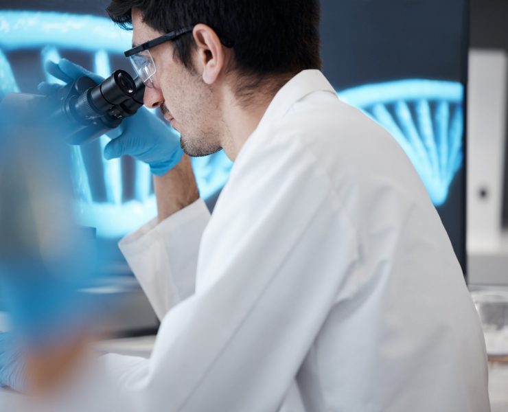 Science, research and microscope with man in laboratory for dna, pharmacy and medical. Medicine, he.